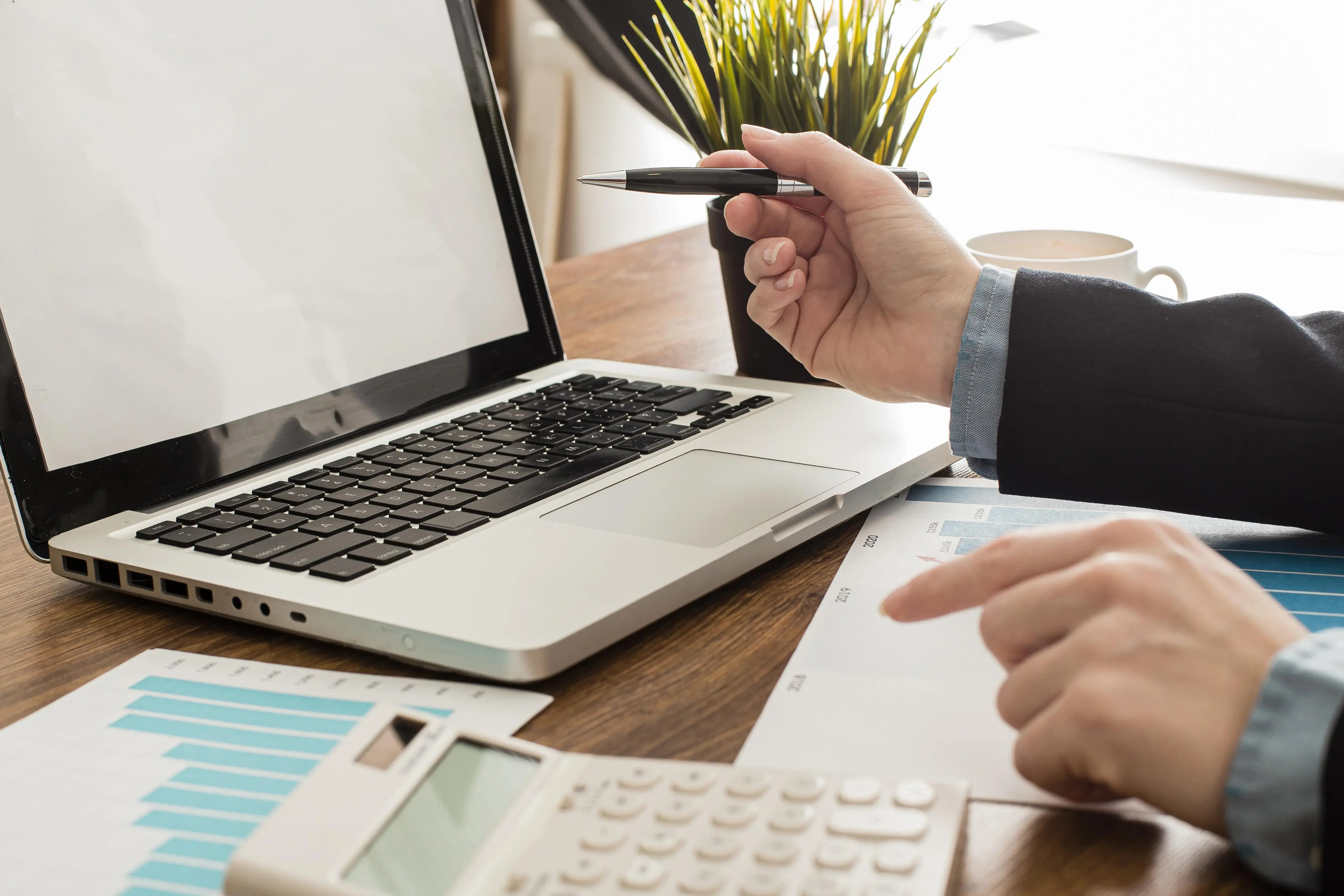 businessman-with-laptop-calculator-office