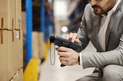 close-up-supervisor-using-scanner-warehouse