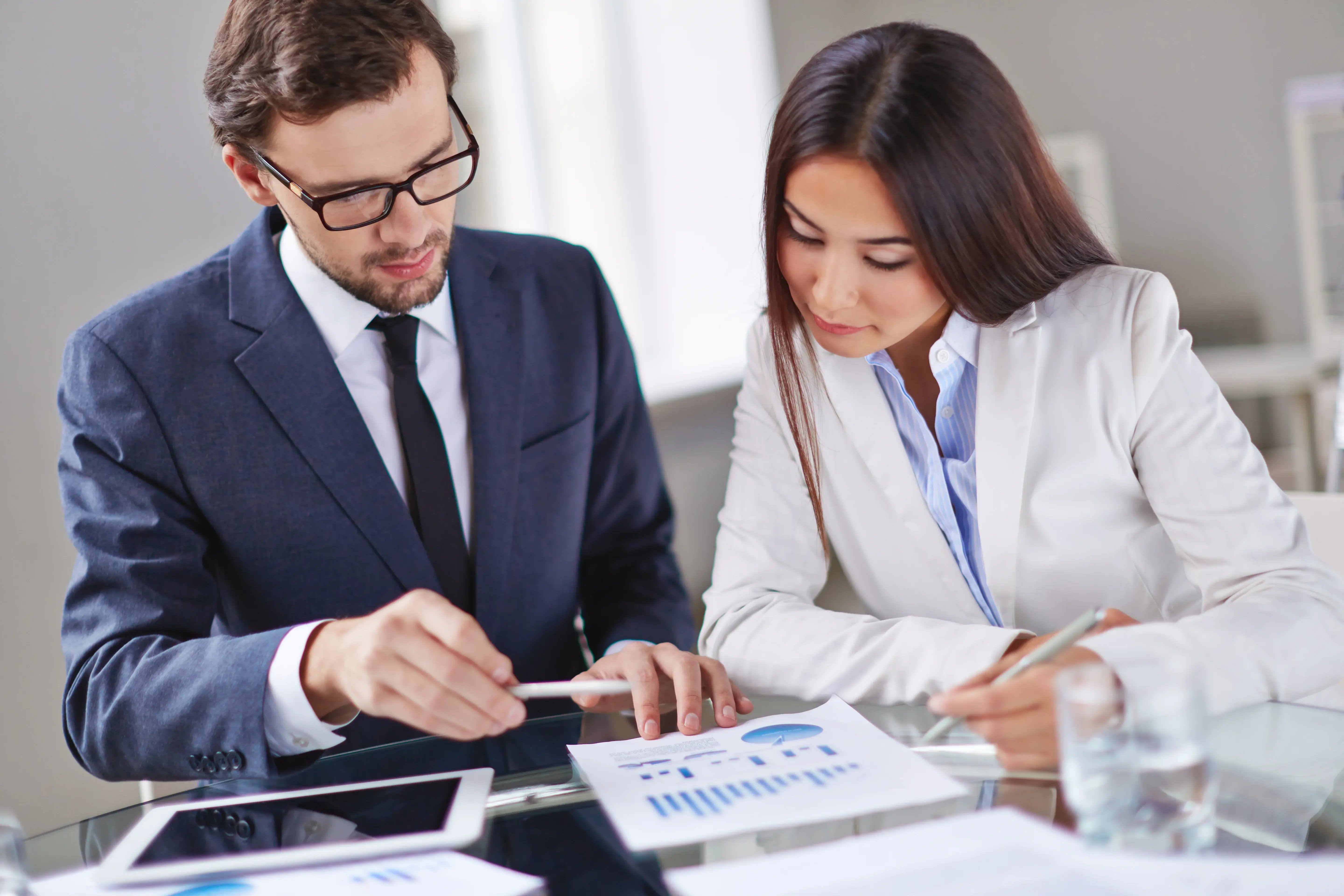 elegant-executives-reviewing-report