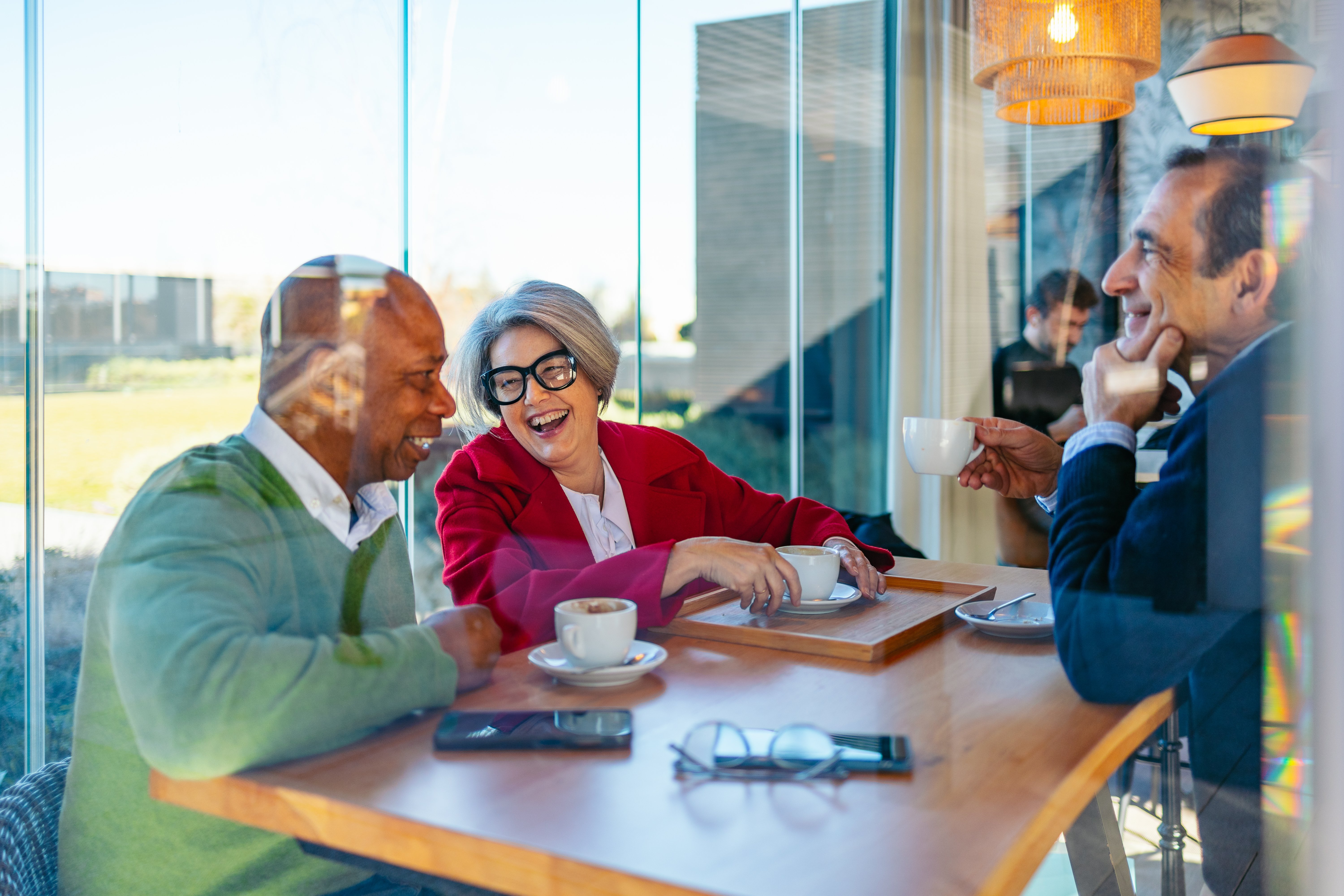 people-enjoying-coffee-meeting-in-cafe-setting-2026-01-09-10-48-37-utc