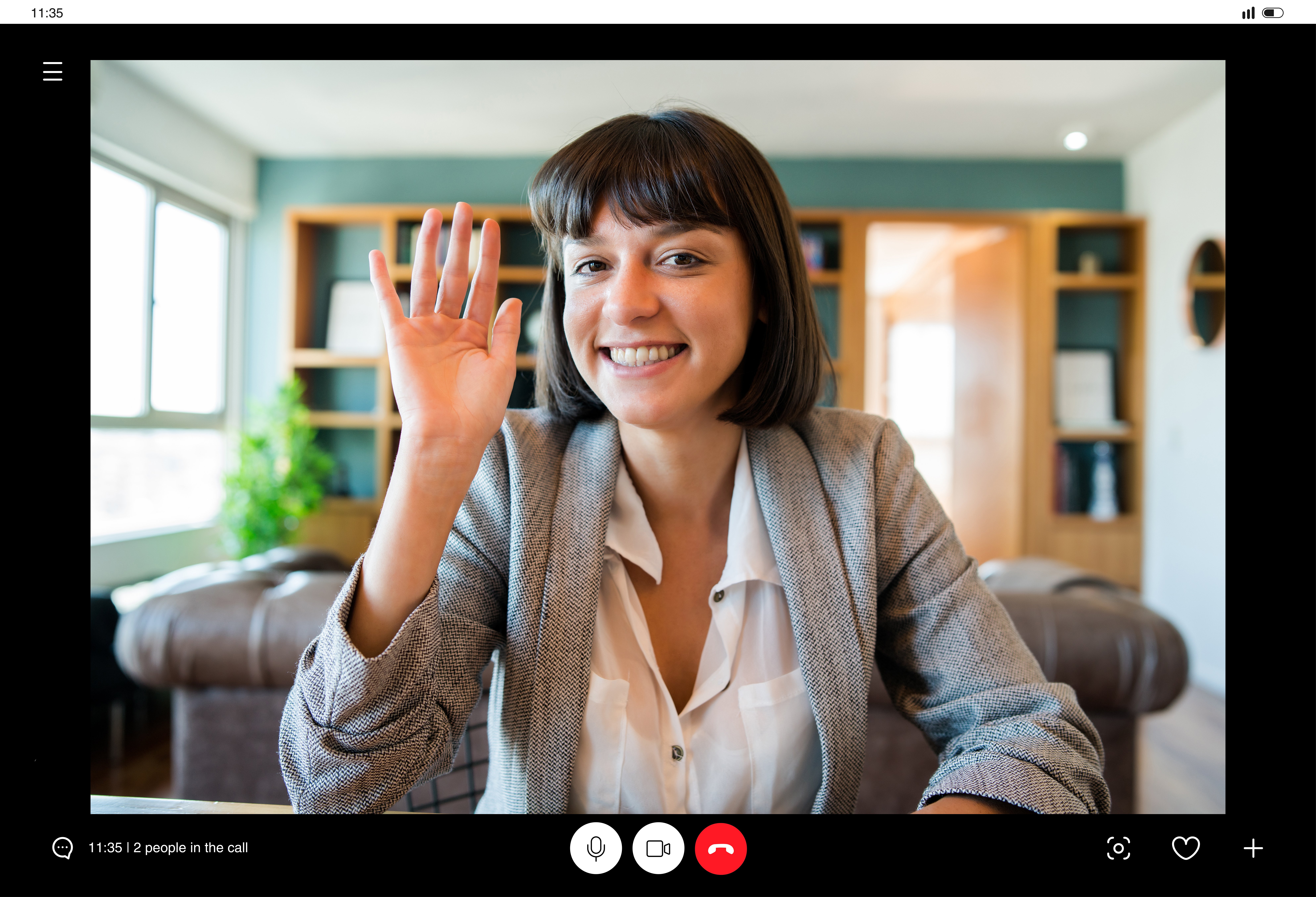 smiling-woman-waving-during-a-video-conference-2026-09-22-10-33-41-utc