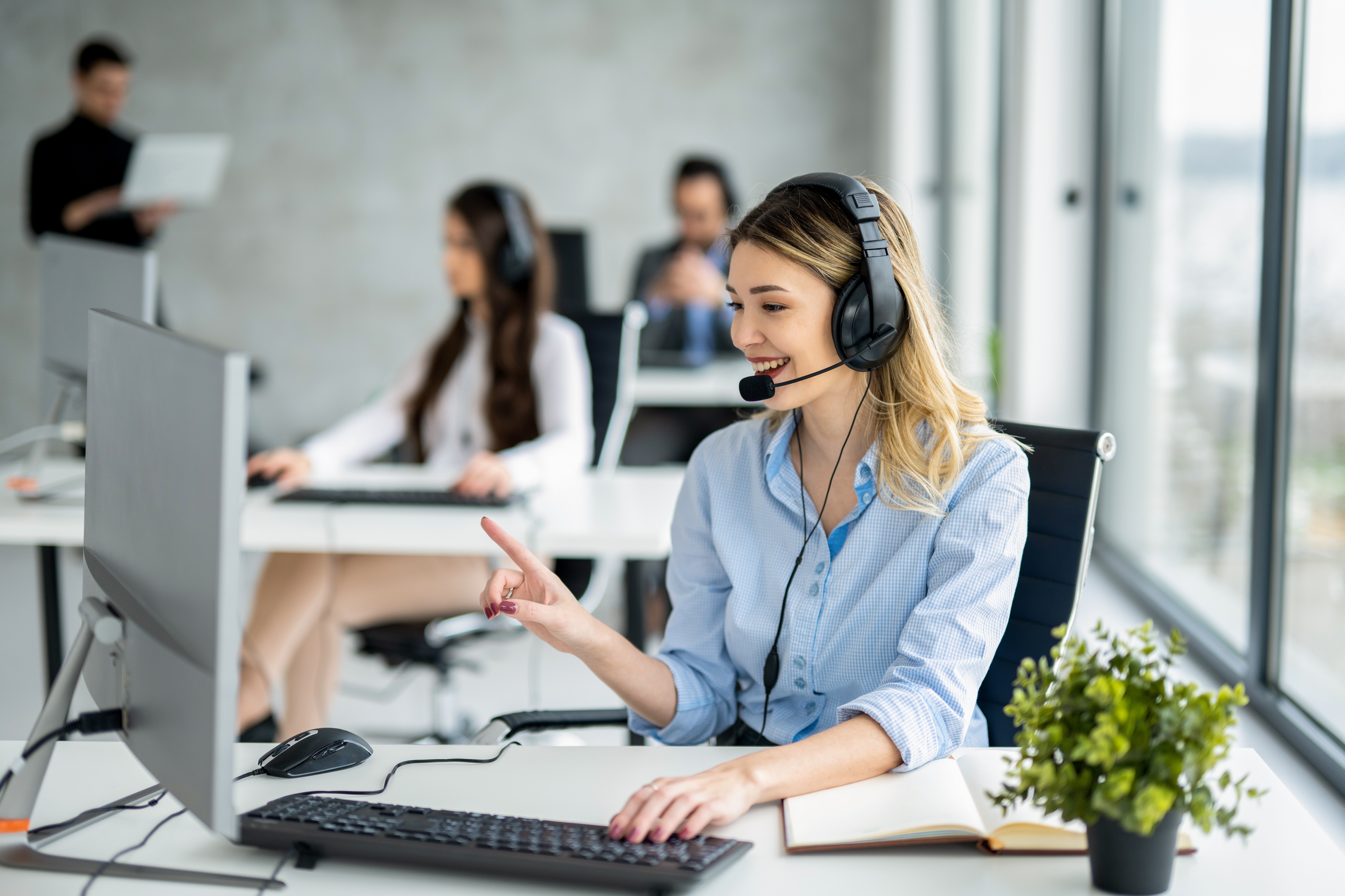 smiling-young-woman-with-headset-working-in-a-brig-2026-09-25-07-03-15-utc